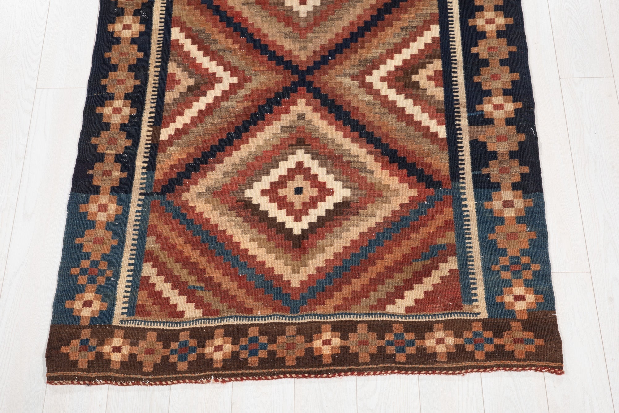 One end of the kilim showing the diamond point and the woven end border.