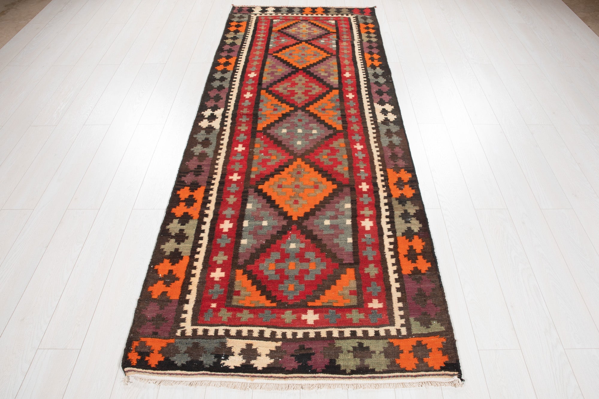 Full-length view of the Persian kilim runner from the opposite end.