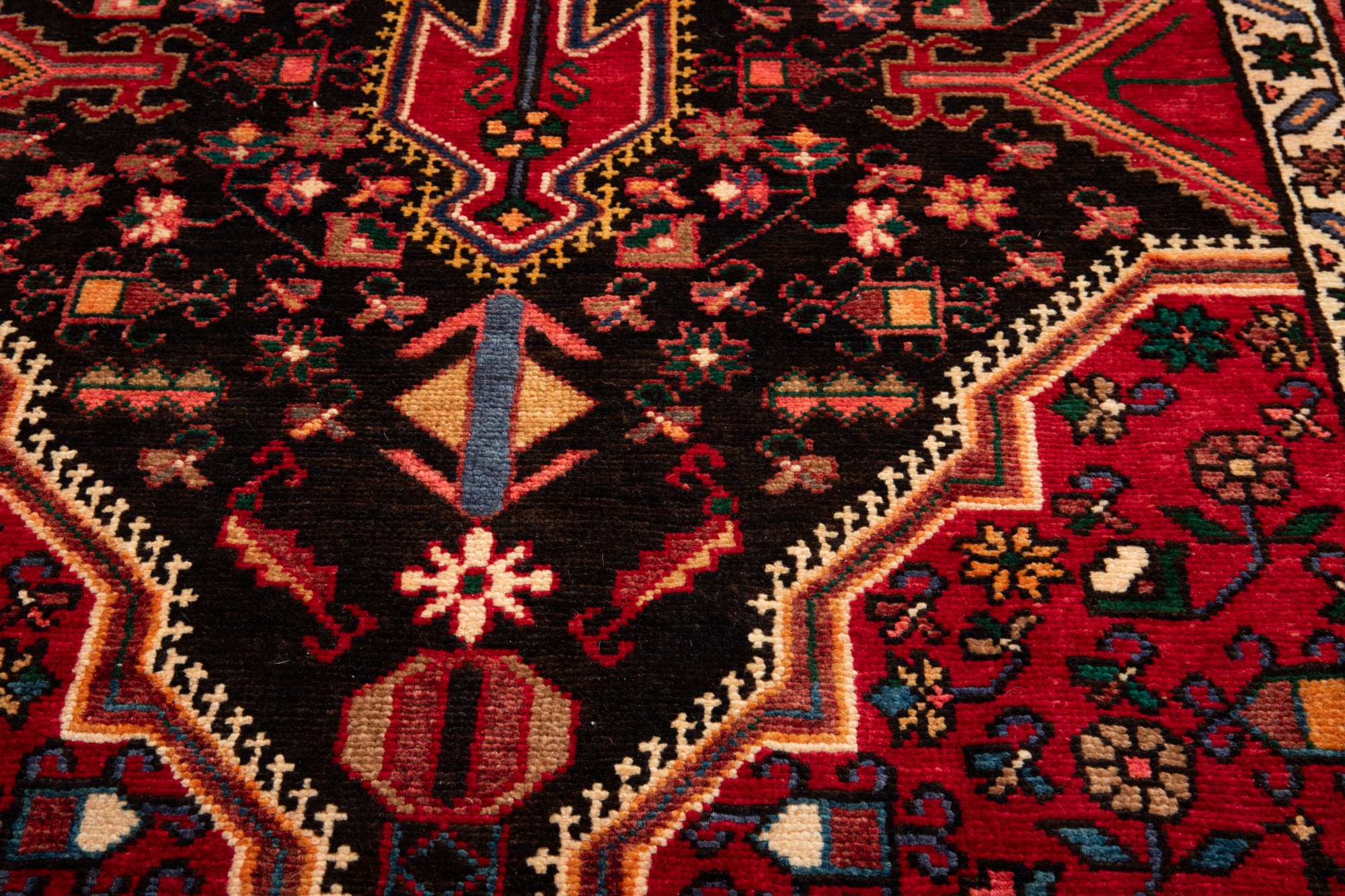 Macro shot of Hand-Knotted Vintage Wool Runner Rug – 9' 3" x 3' 5" highlighting the fine weave and detailed floral and geometric patterns.