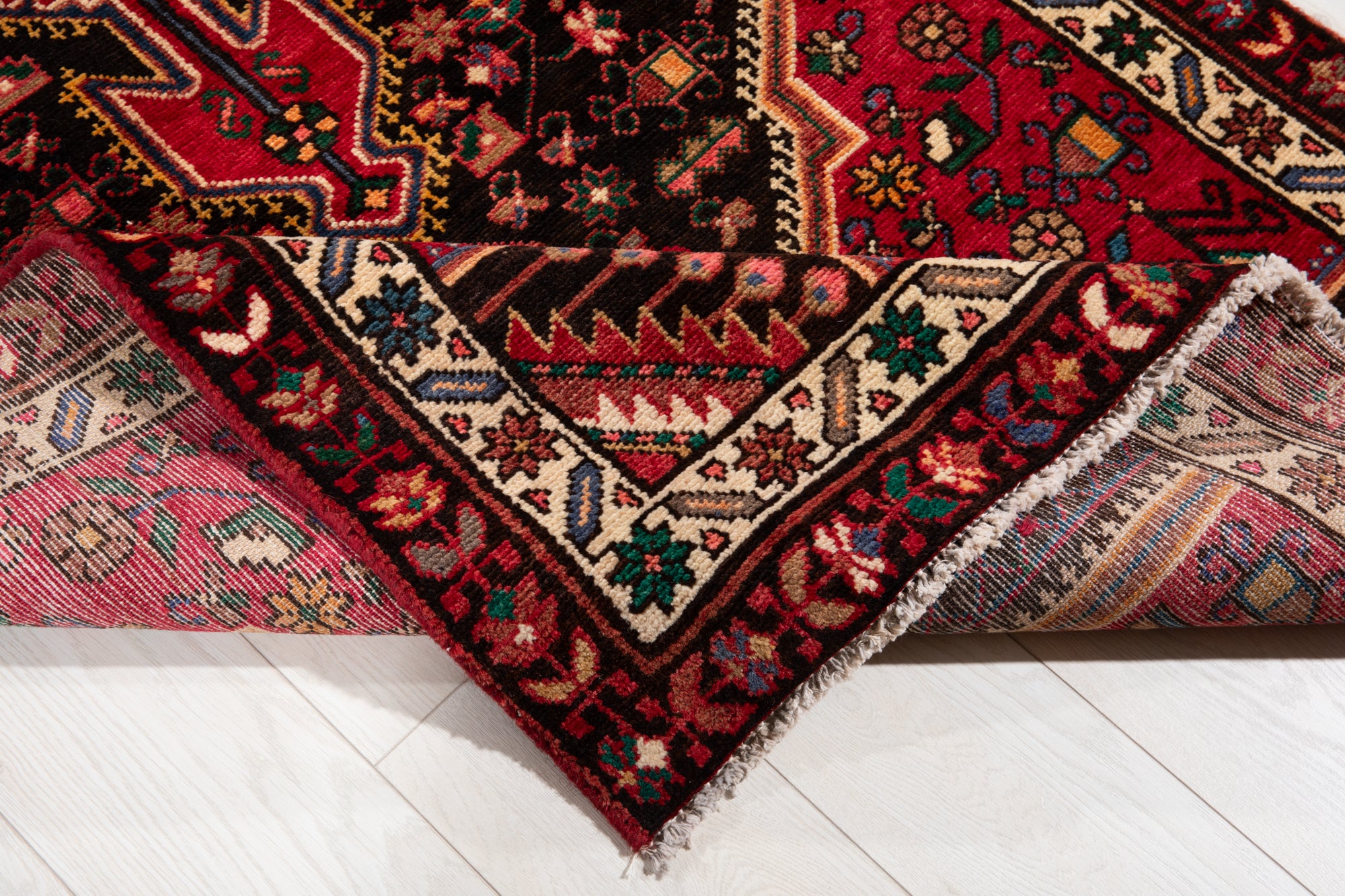 Backside of Hand-Knotted Vintage Wool Runner Rug – 9' 3" x 3' 5" flipped to show hand-knotted construction and colorful pattern alignment.