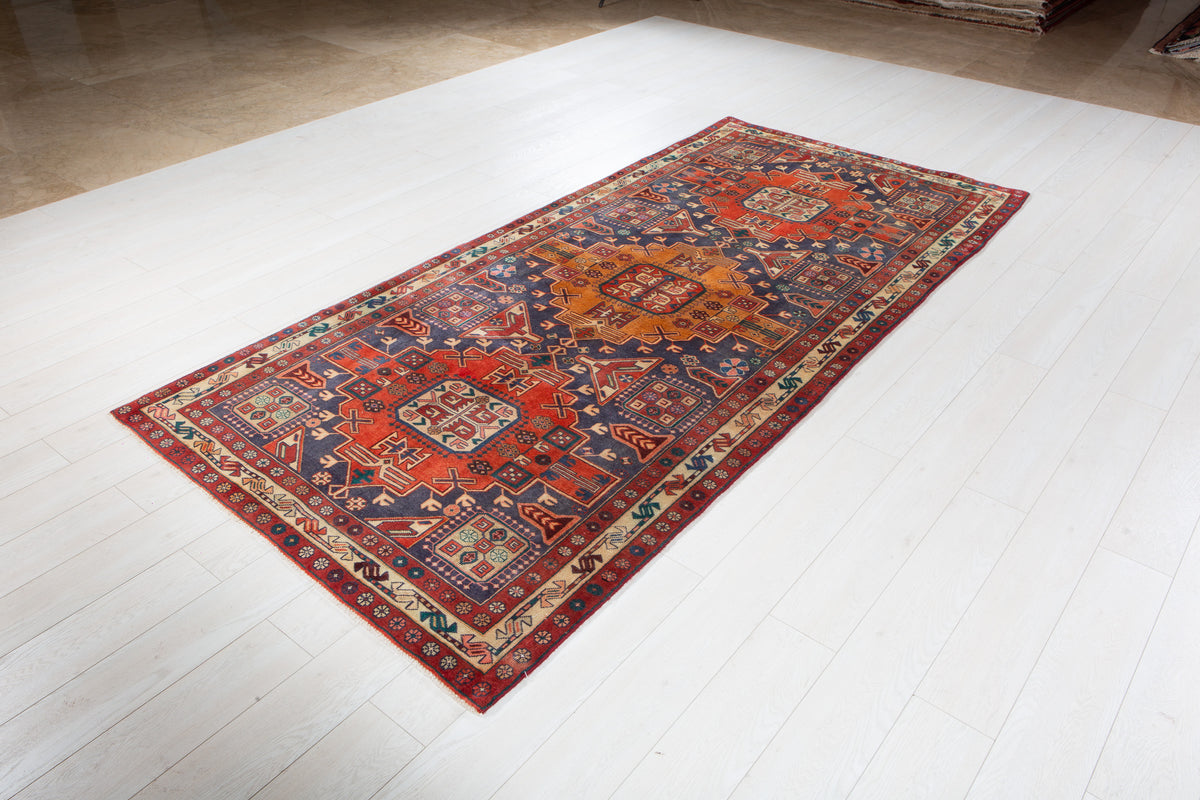 Vintage Navy Blue & Red Geometric Medallion Wool Rug – 9' 3" x 4' 4" (282 x 131 cm)