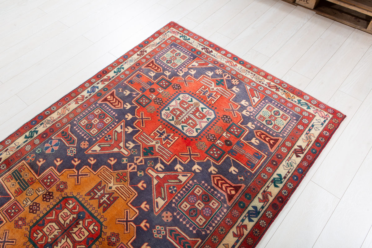 Vintage Navy Blue & Red Geometric Medallion Wool Rug – 9' 3" x 4' 4" (282 x 131 cm)