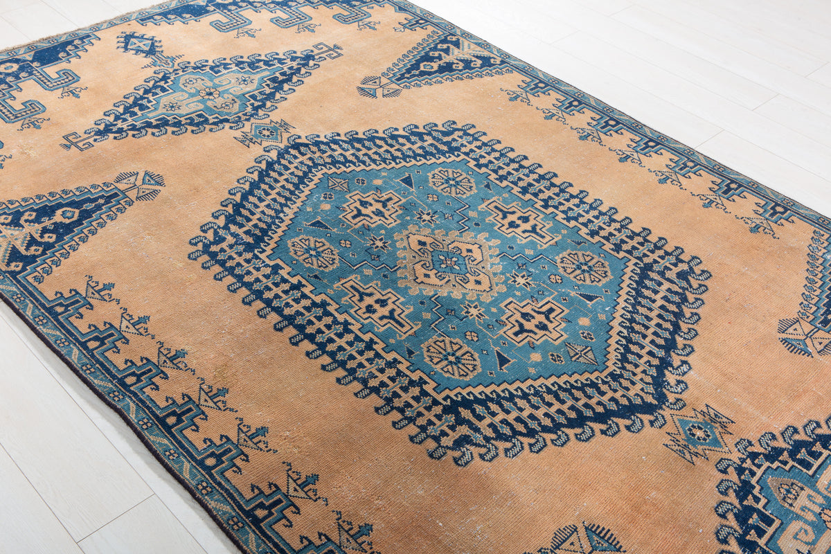 Collectible Antique Muted Orange & Blue Geometric Medallion Wool Rug – 9' 7" x 5' 1" (291 x 155 cm)