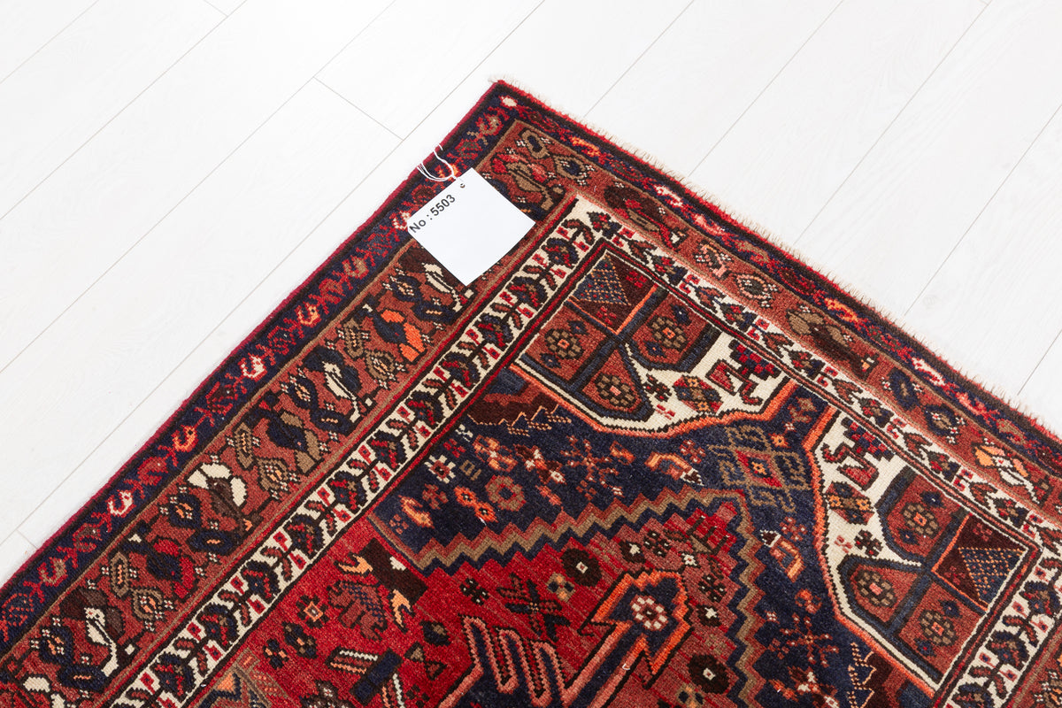 Tapis vintage rouge rouille et bleu marine à médaillon central – 6' 10" x 3' 3" (208 x 100 cm)