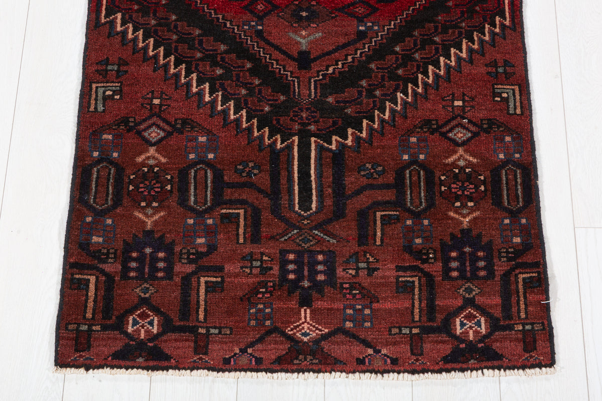 Vintage Rust Red and Black Narrow Geometric Medallion Hand-Knotted Area Rug – 6' 6" x 2' 9" (199 x 84 cm)