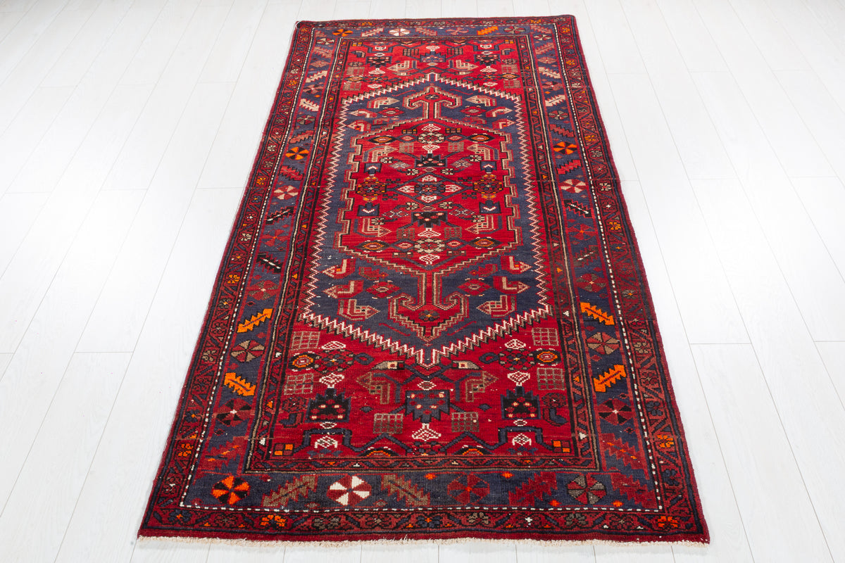Vintage Red and Faded Navy Blue Geometric Hand-Knotted Area Rug – 6' 11" x 3' 7" (212 x 110 cm)