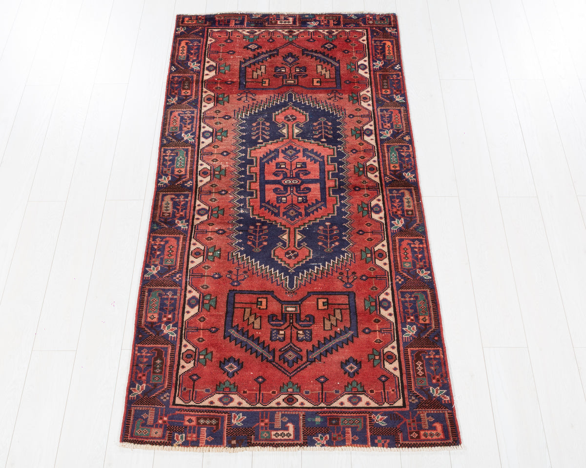 Vintage Zanjan rust red and navy blue geometric area rug with low worn pile, 3x6, SKU 5428