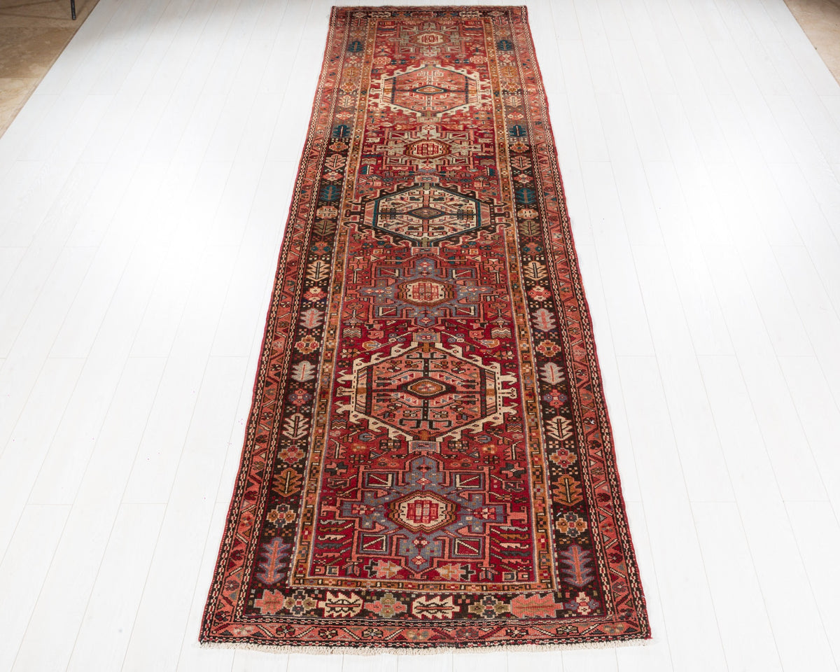 Semi-antique Gharajeh Heriz wool runner in red with bold geometric medallions, 4x13, SKU 5124