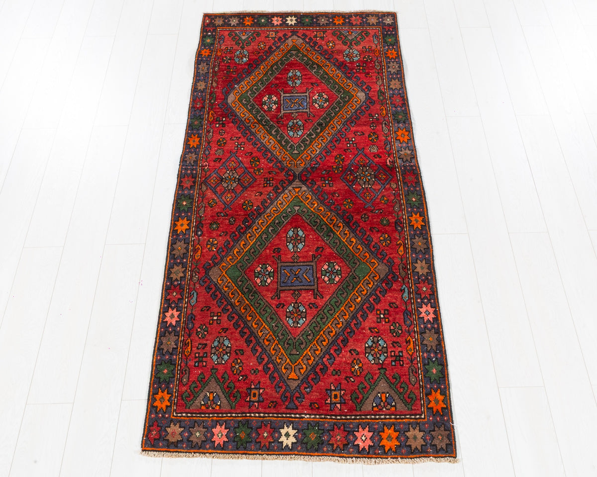 Semi-antique Hamadan wool rug in red and green with bold double-diamond geometric medallions, 3x7, SKU 5126