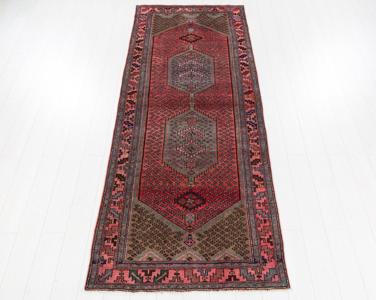 Rare vintage Zanjan runner with coral red field, soft blue twin medallions and pink border, SKU 5139