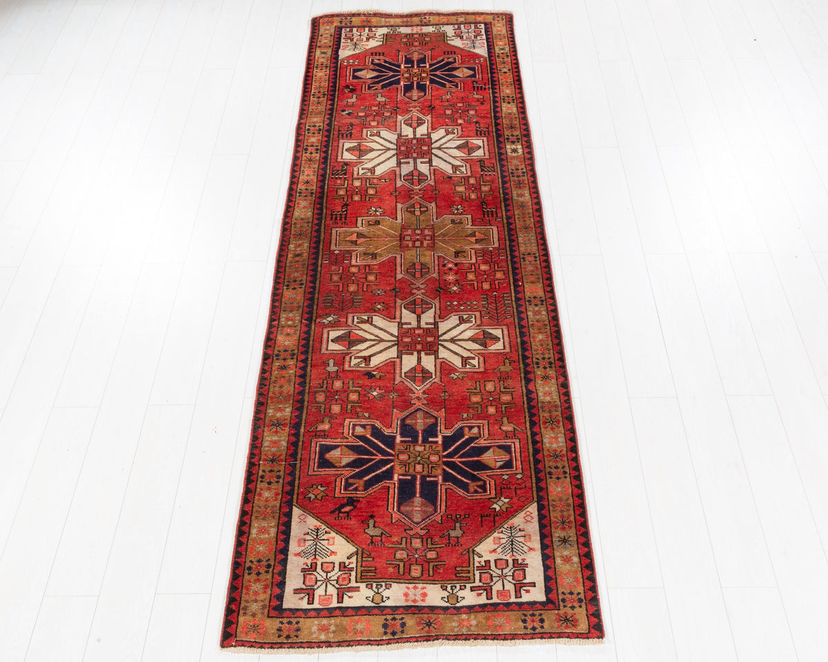 Rare vintage Heriz runner with coral-red field and large camel, ivory and navy geometric medallions, SKU 5158