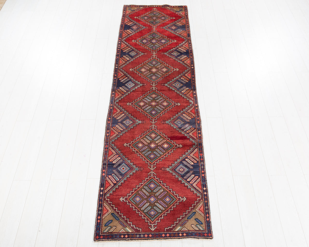 Vintage Kurdish runner rug in Red, deep navy blue, earthy brown SKU 5360