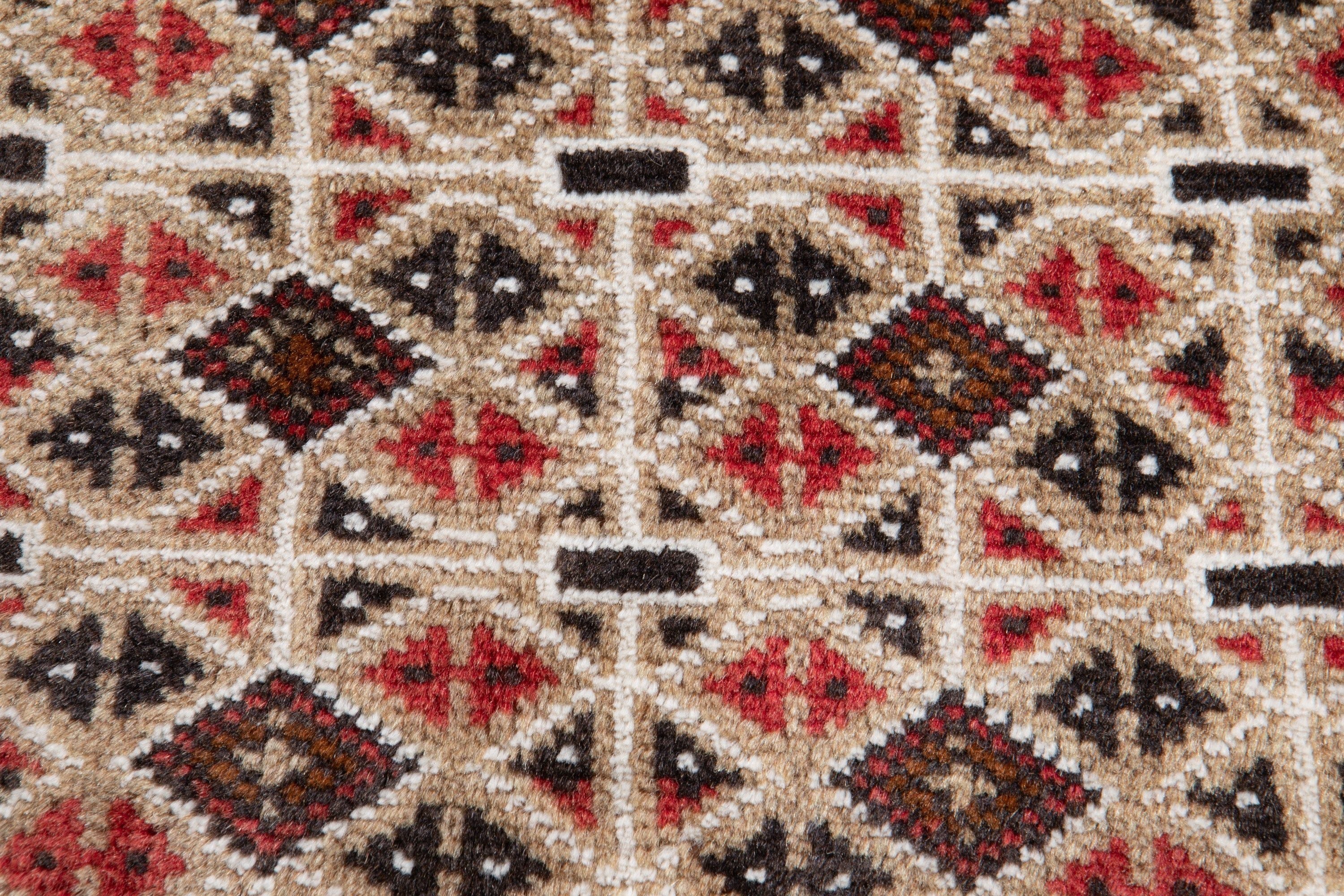 Extreme close-up of the wool pile texture showing the geometric diamond pattern in detail.