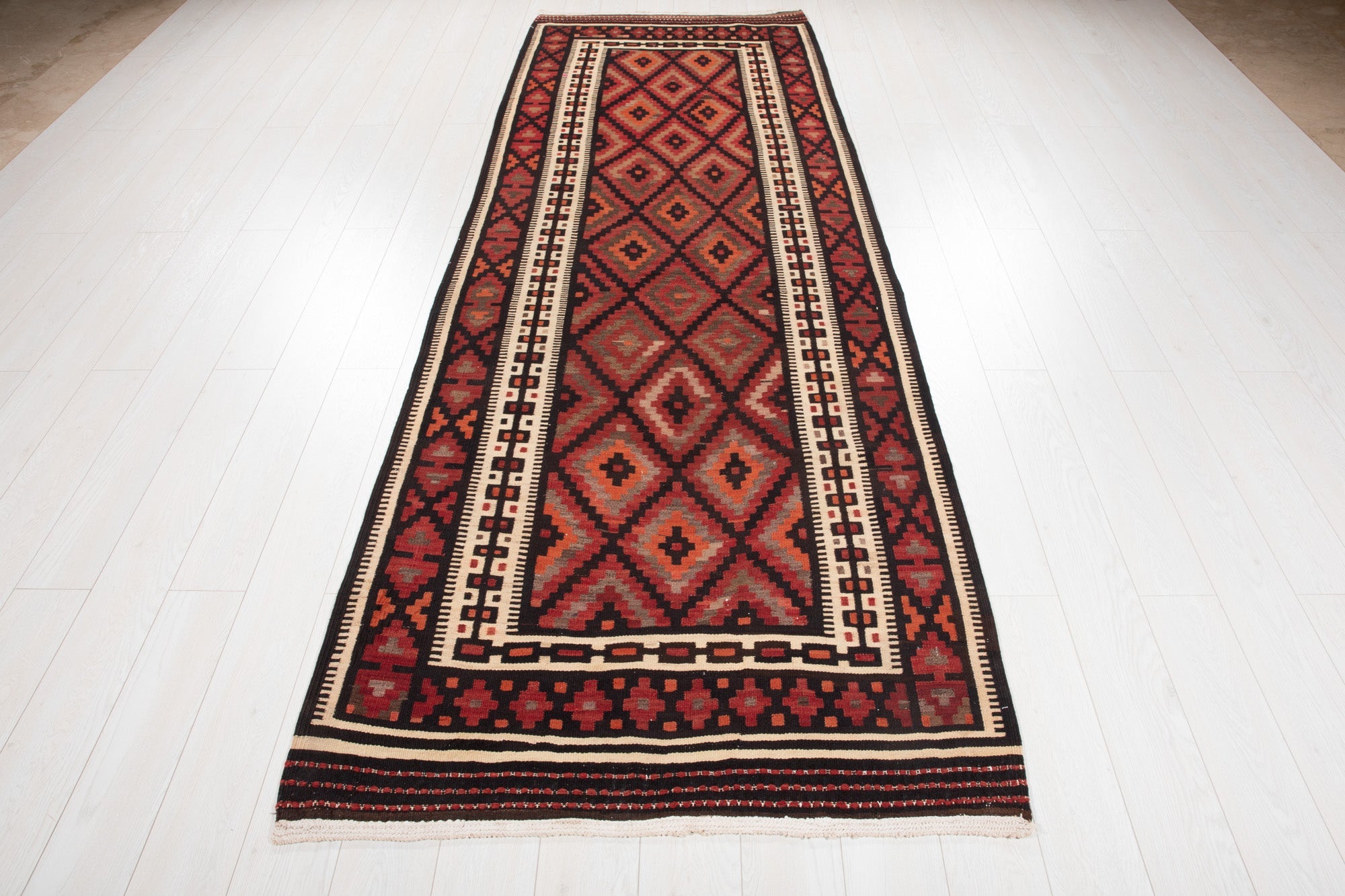 Full-length view of the Persian kilim runner from the opposite end.