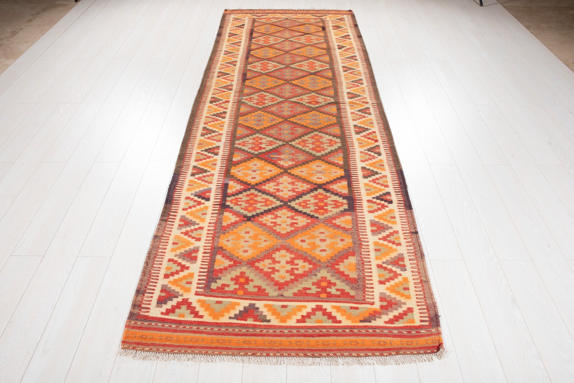 Full-length view of the Persian kilim runner from the opposite end.