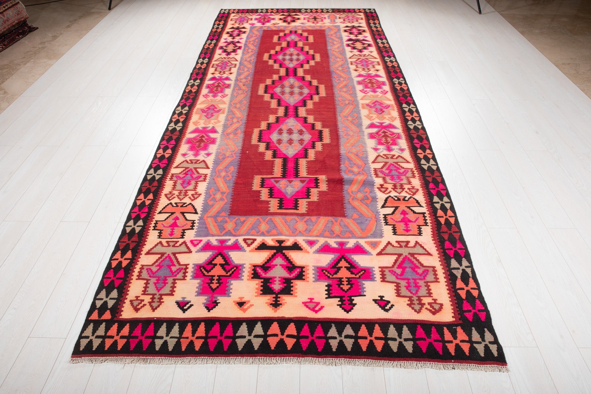 Full-length view of the Persian Shiraz kilim rug from the opposite end.