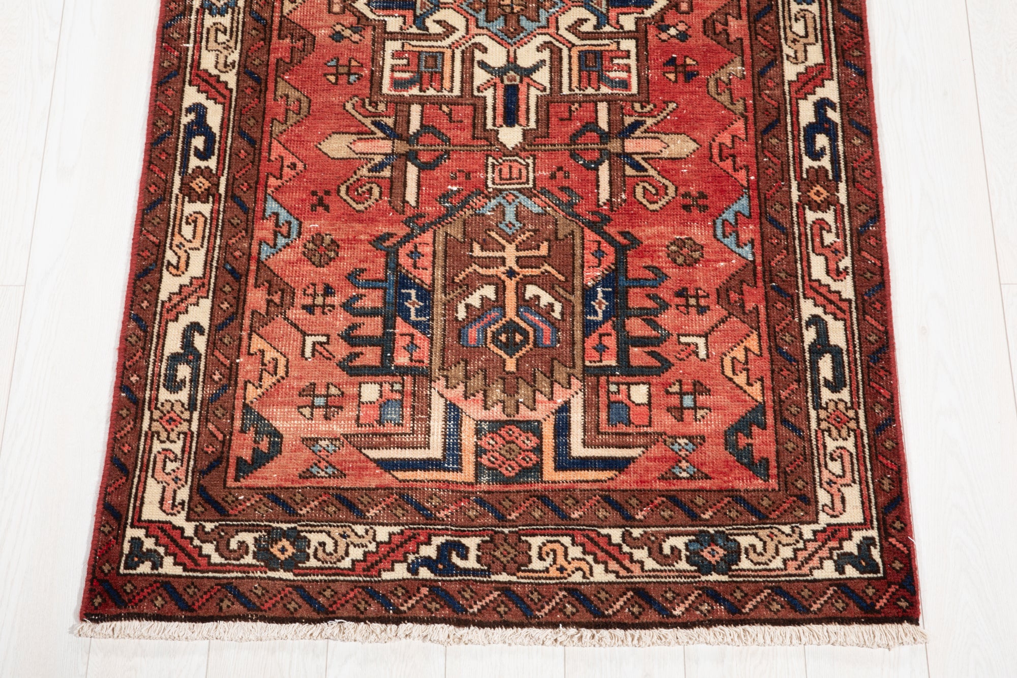 Bottom end of Hand-Knotted Antique Wool Runner Rug – 14' 9" x 3' 4" with visible fringe and detailed border patterns in earthy tones.