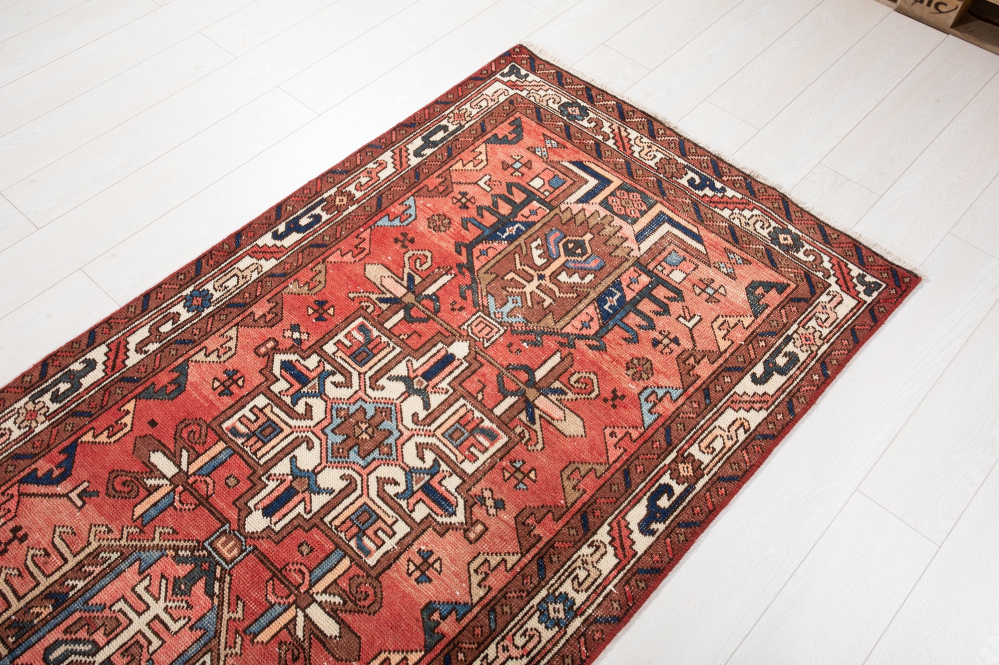 Corner detail of Hand-Knotted Antique Wool Runner Rug – 14' 9" x 3' 4" with visible geometric motifs and traditional border accents.