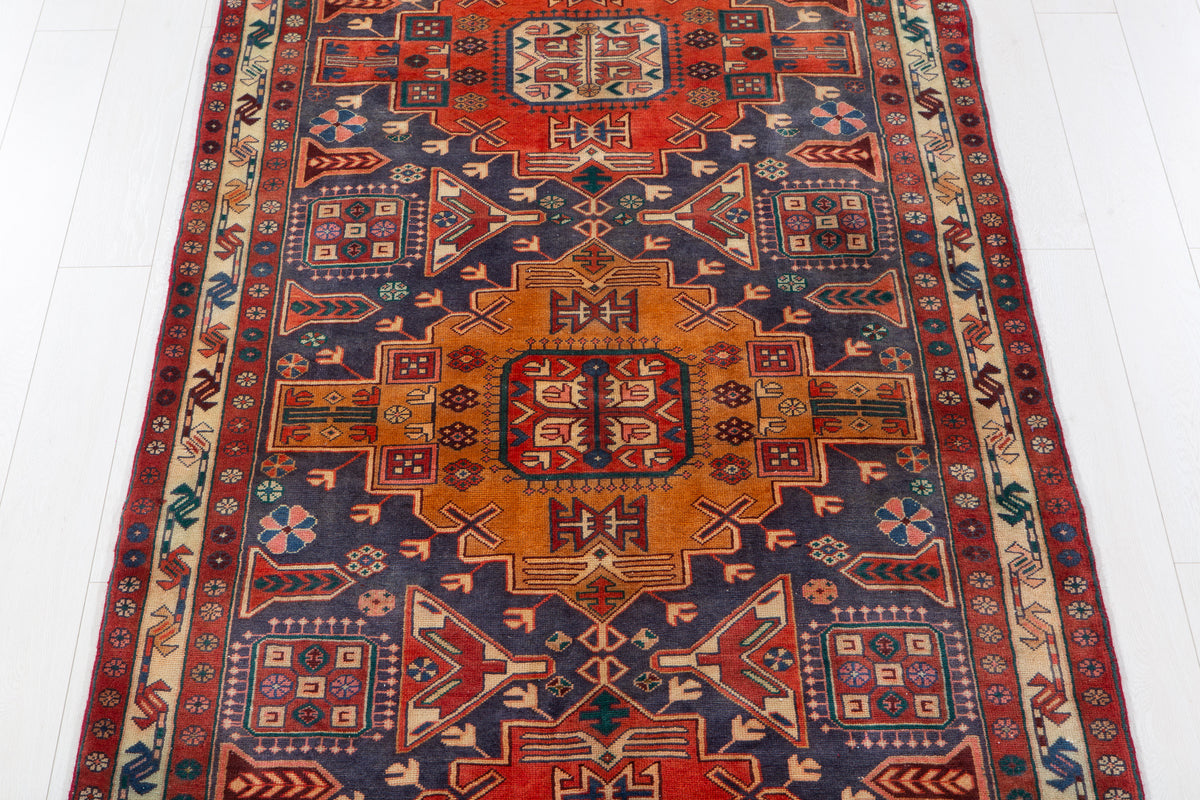 Vintage Navy Blue & Red Geometric Medallion Wool Rug – 9' 3" x 4' 4" (282 x 131 cm)