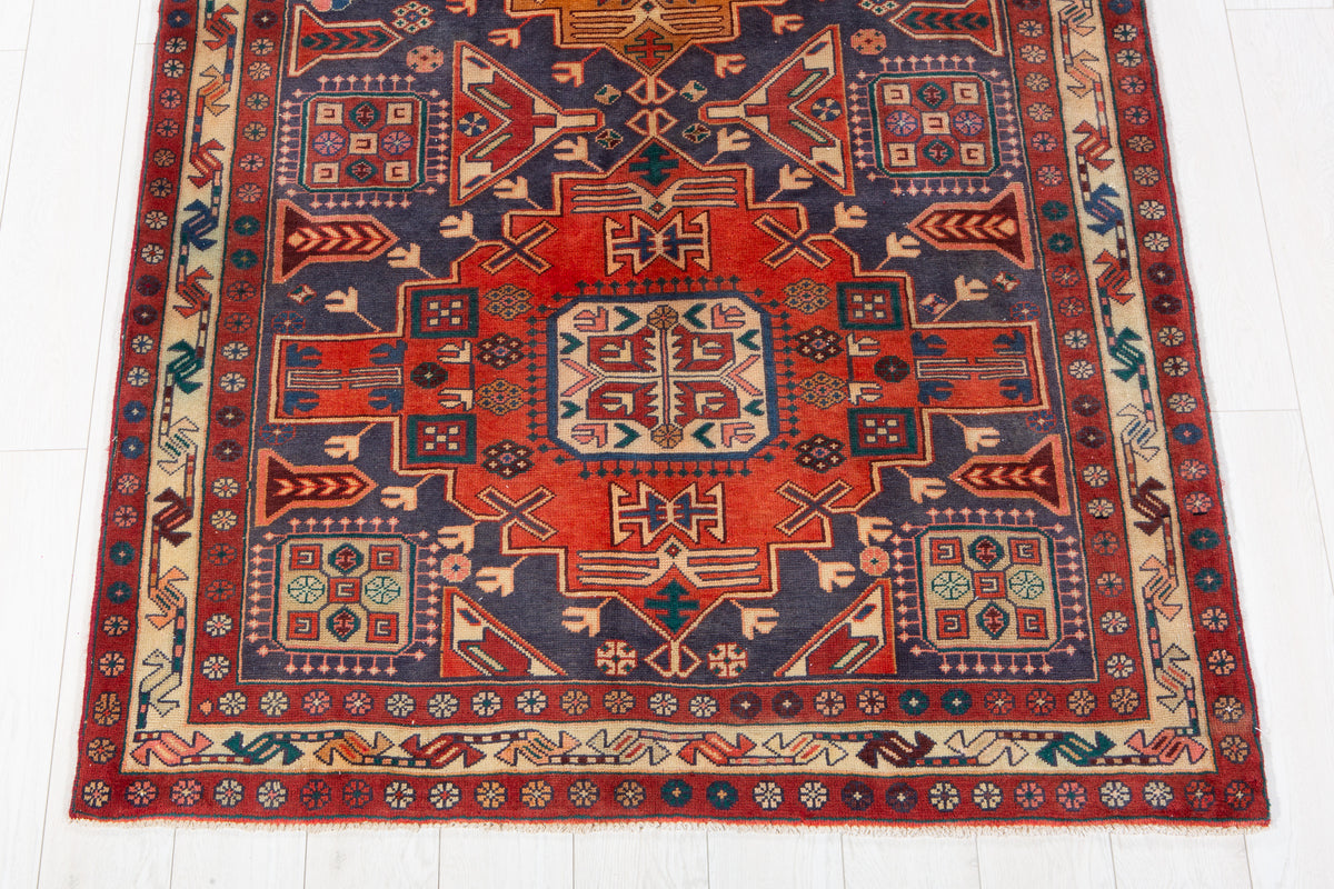 Vintage Navy Blue & Red Geometric Medallion Wool Rug – 9' 3" x 4' 4" (282 x 131 cm)