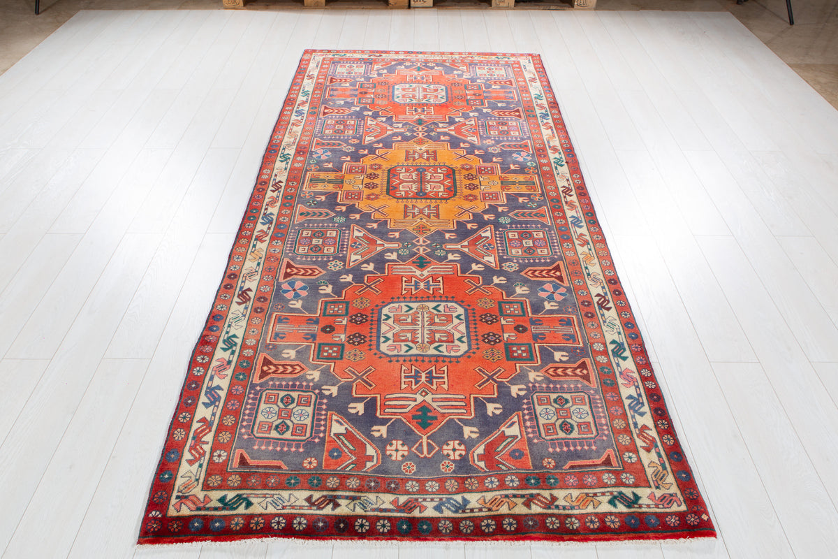 Vintage Navy Blue & Red Geometric Medallion Wool Rug – 9' 3" x 4' 4" (282 x 131 cm)