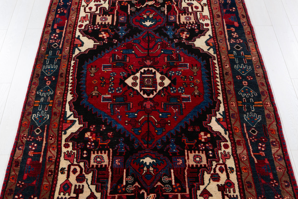 Antique Navy Blue & Red Geometric Medallion Wool Rug – 10' 5" x 5' 3" (317 x 161 cm)