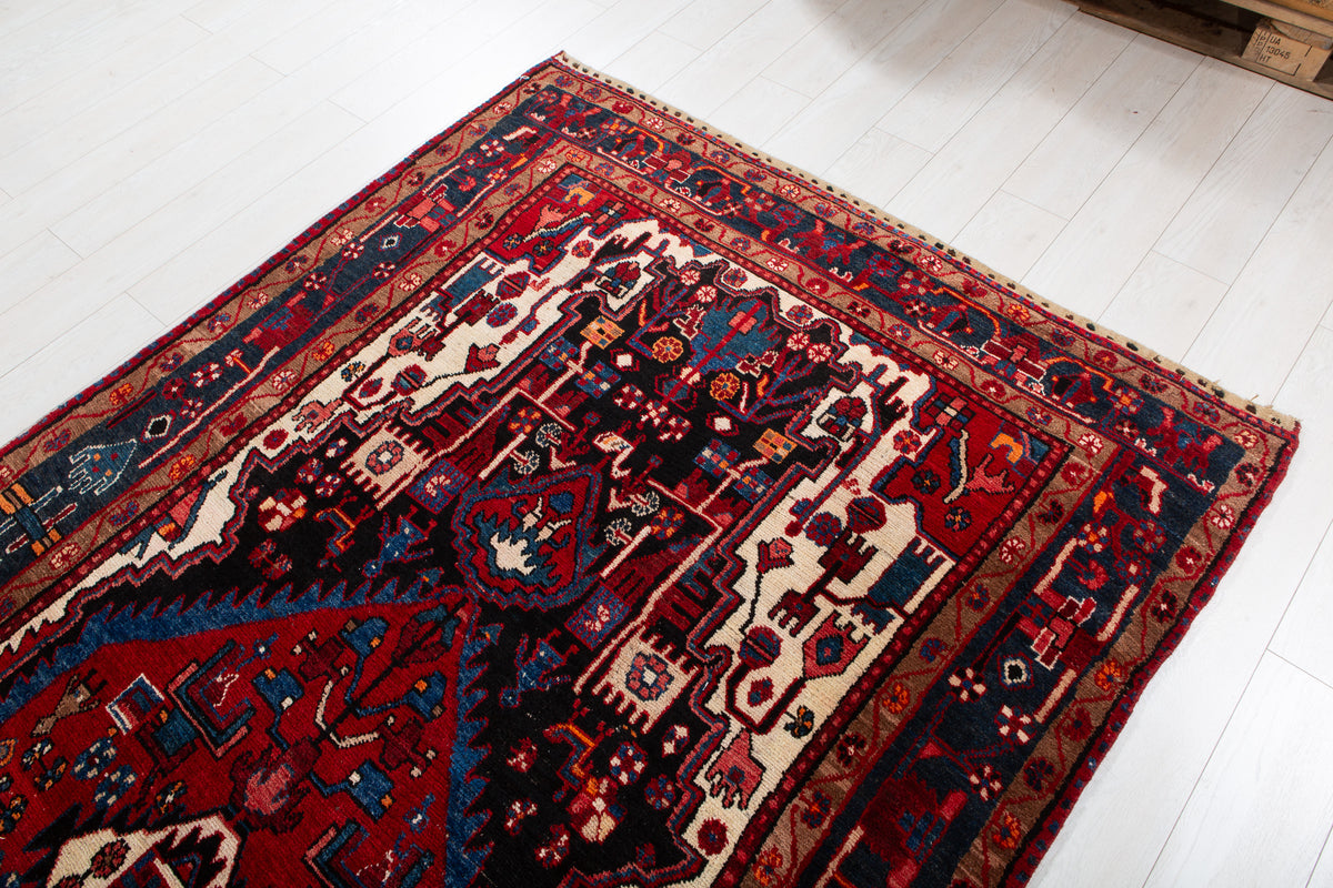 Antique Navy Blue & Red Geometric Medallion Wool Rug – 10' 5" x 5' 3" (317 x 161 cm)