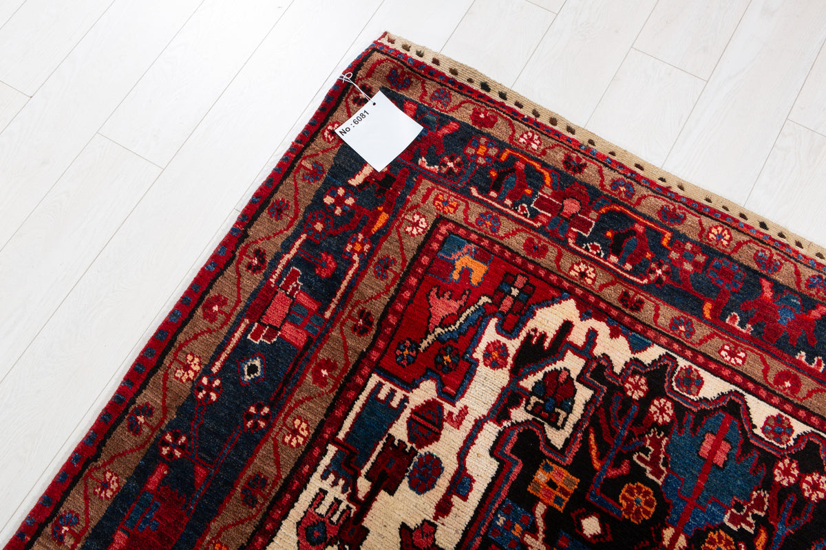 Antique Navy Blue & Red Geometric Medallion Wool Rug – 10' 5" x 5' 3" (317 x 161 cm)