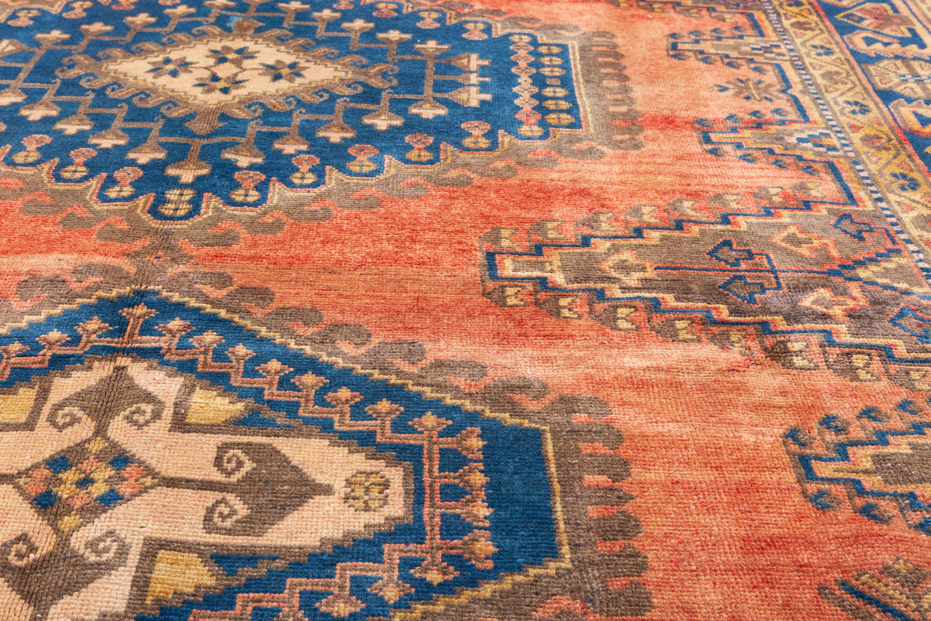 Collectible Vintage Faded orange-red and navy Geometric Rug – 9' 11" x 6' 7" (302 x 200 cm)