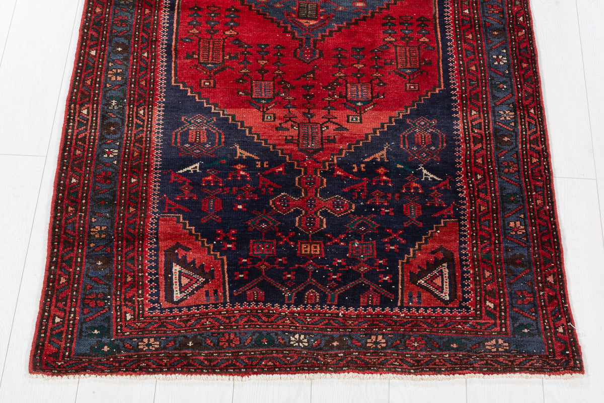 Vintage Red and Navy Blue Elongated Medallion Hand-Knotted Area Rug – 6' 8" x 3' 5" (204 x 104 cm)