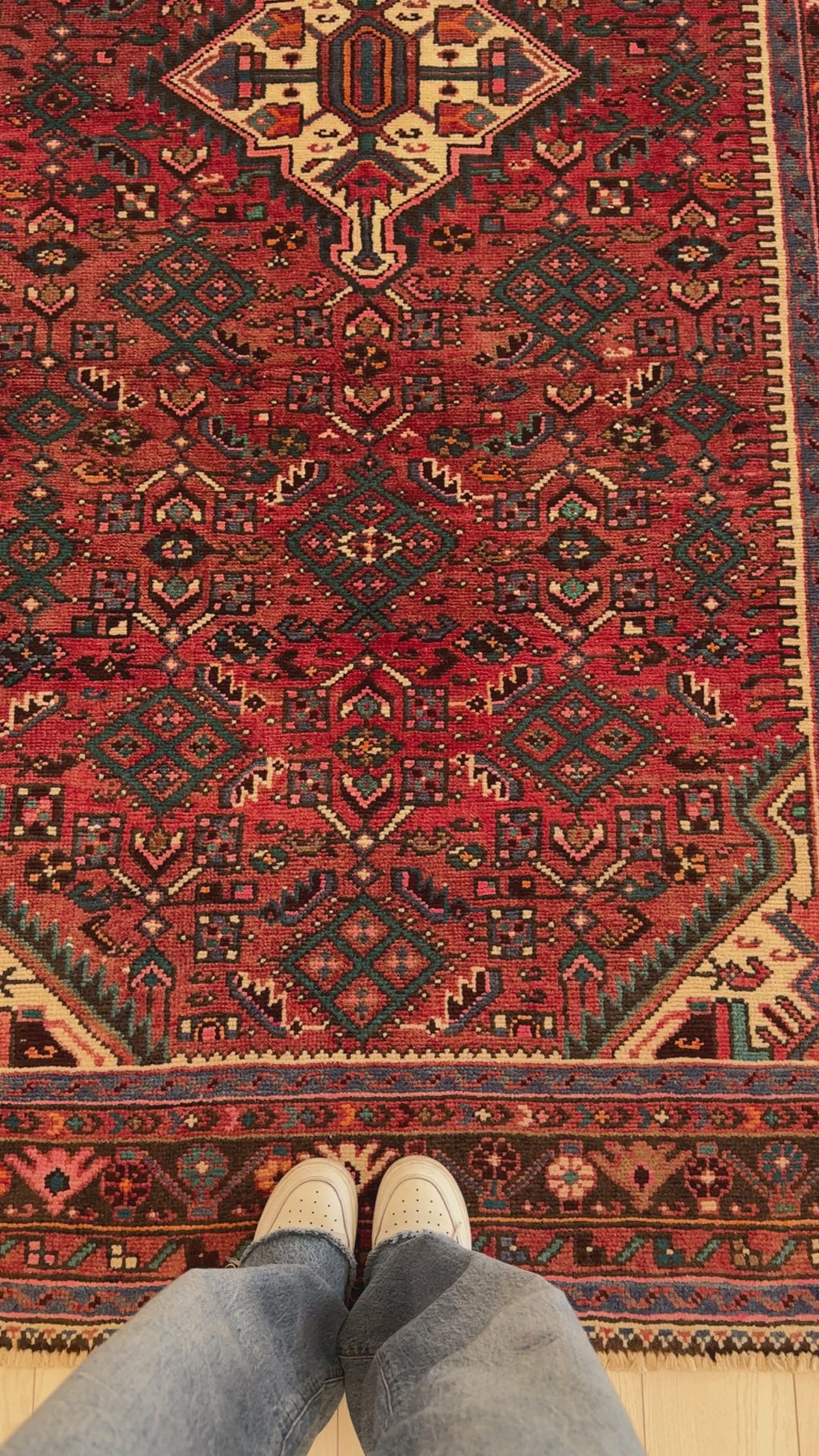Close-up top-down view of Hand-Knotted Vintage Red Persian 5x9 Hamadan Tribal Area Rug showing detailed geometric motifs and rich red tones.