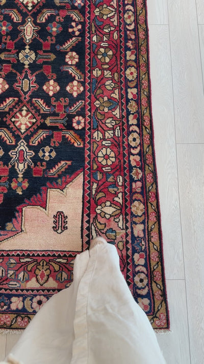 Detailed corner view of Hand-Knotted Vintage Wool Large Area Rug – 10' 8" x 7' 3" highlighting floral border and fine wool weave.
