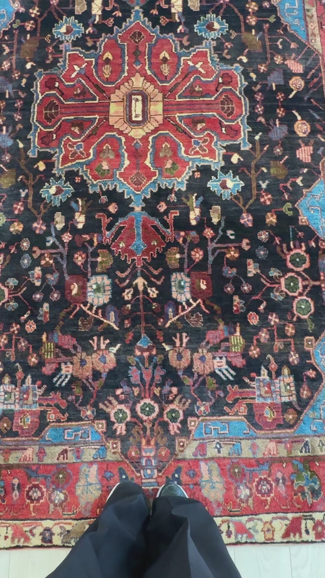 Close-up of central medallion and floral patterns on Hand-Knotted Vintage Wool Area Rug – 9' 2" x 5' 4" in deep red and black hues.