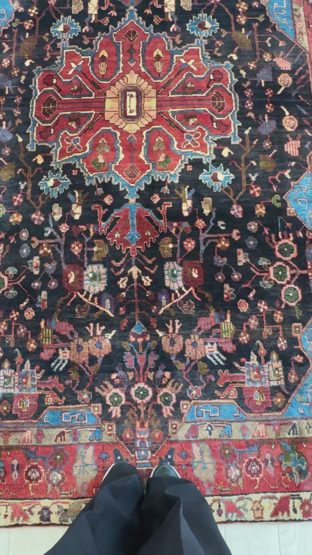 Close-up of central medallion and floral patterns on Hand-Knotted Vintage Wool Area Rug – 9' 2" x 5' 4" in deep red and black hues.