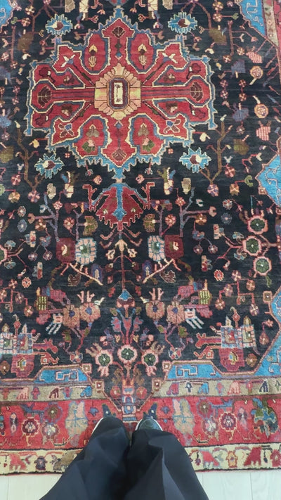 Close-up of central medallion and floral patterns on Hand-Knotted Vintage Wool Area Rug – 9' 2" x 5' 4" in deep red and black hues.