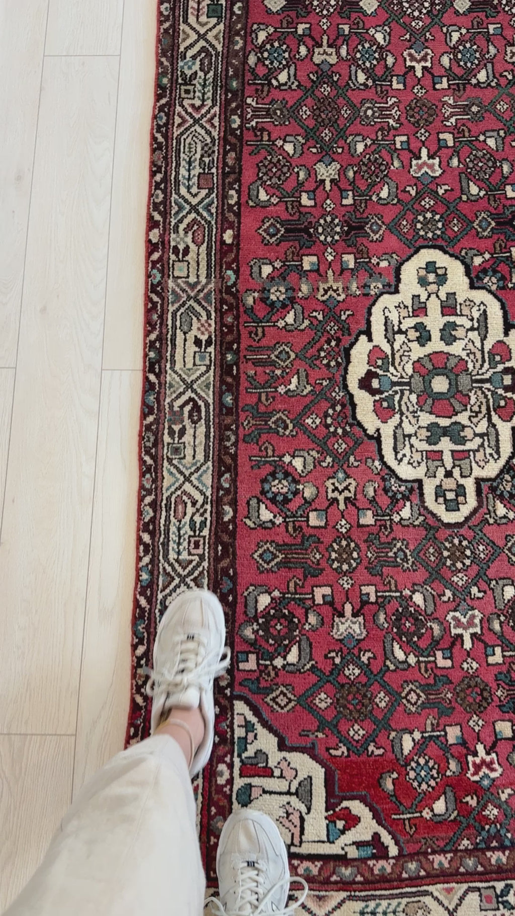 Close-up of Hand-Knotted Vintage Wool Runner Rug – 12' 7" x 3' 4" showing fine wool texture and traditional red and ivory motifs near foot for scale.