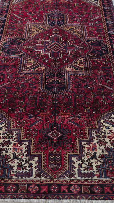 Close-up of central medallion on Hand-Knotted Vintage Wool Area Rug – 9' 3" x 4' 9" highlighting fine craftsmanship and symmetrical motifs.