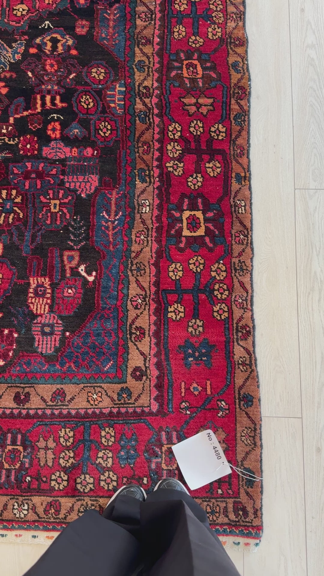 Close-up of corner details on Hand-Knotted Vintage Wool Area Rug – 9' 8" x 4' 9" highlighting floral border motifs and fine wool texture.