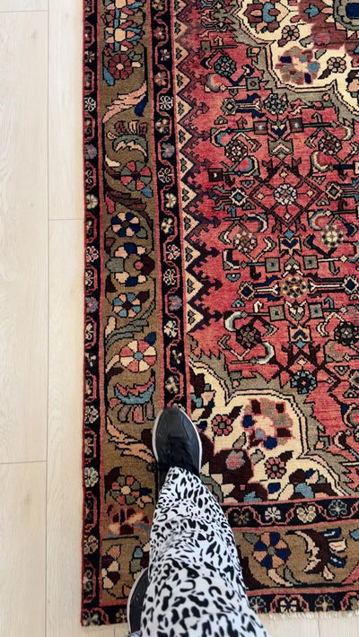 Close-up of corner detail on Hand-Knotted Vintage Wool Area Rug – 10' 2" x 5' 1", showing floral border and fine wool texture.