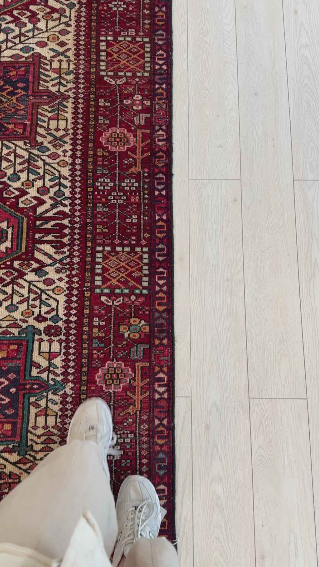 Detailed view of border design on Hand-Knotted Vintage Wool Runner Rug 11'2 x 3'6 with traditional red and navy patterns on ivory background.