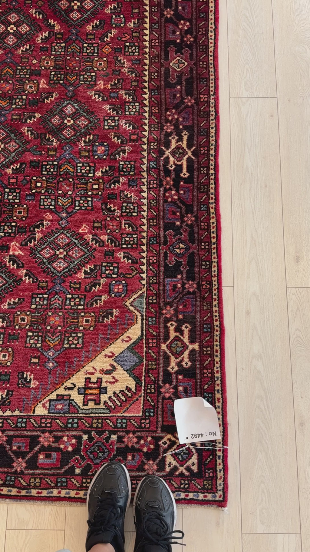 Close-up of corner detail on Hand-Knotted Vintage Wool Area Rug – 11' x 5' 10", showcasing fine craftsmanship and rich red tones.