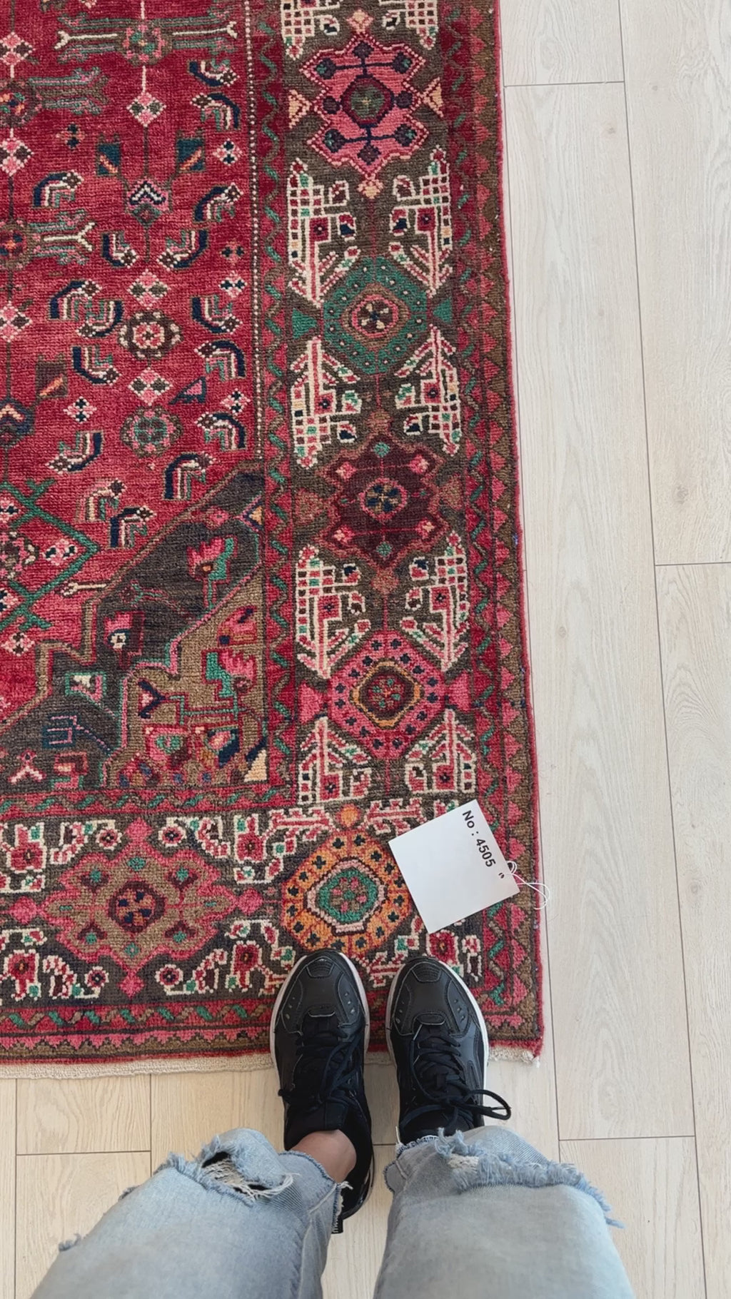 Close-up of hand-knotted vintage wool rug 10' 2" x 5' 3" showing detailed border design and texture, perfect for home and garden decor.