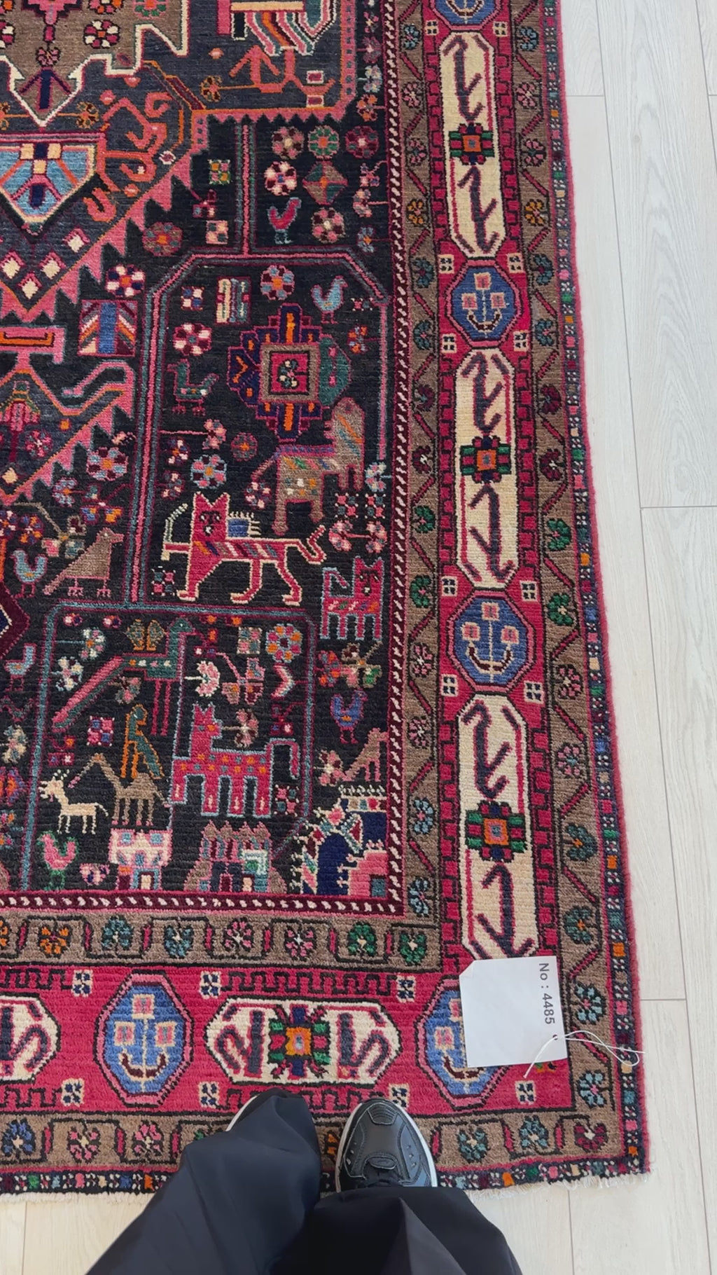 Close-up of Hand-Knotted Vintage Wool Area Rug – 10' 2" x 5' corner showing fine wool texture and colorful border design, ideal for decor enthusiasts.