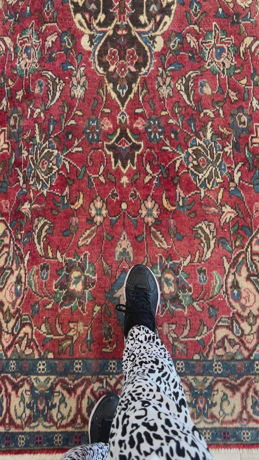 Close-up of Hand-Knotted Vintage Wool Runner Rug – 10' x 4' 5" showing detailed floral motifs and rich red background underfoot.