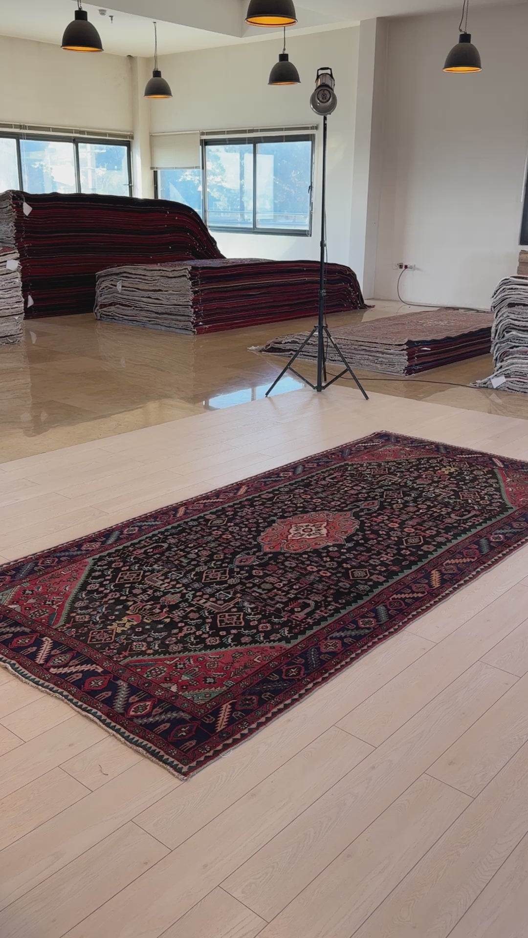 Hand-Knotted Vintage Wool Area Rug – 10' 4" x 4' 10" laid flat in a showroom with natural lighting, highlighting its deep color palette and fine craftsmanship.