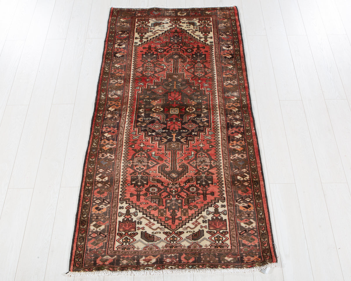 Antique Zanjan wool rug in Faded rust red, 199 x 100 cm