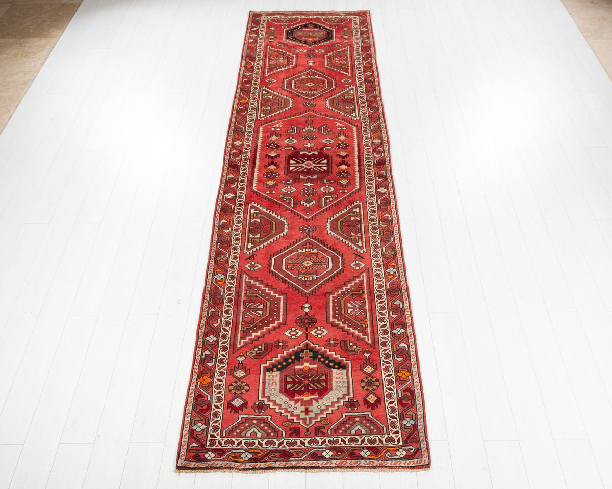 Vintage Hamadan runner rug with coral field and geometric medallions, SKU 5135