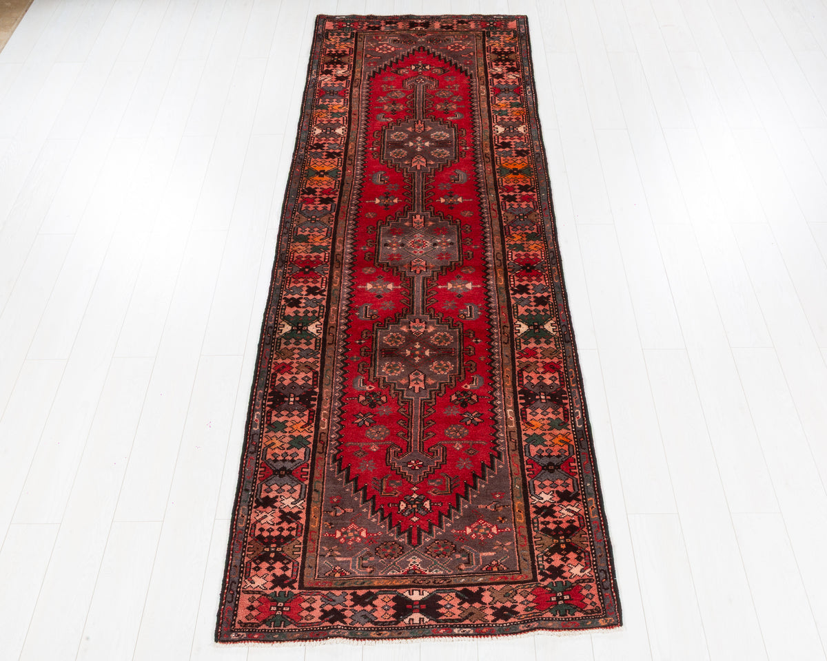 Vintage Zanjan geometric medallion wool runner rug in red and salmon pink, SKU 5203