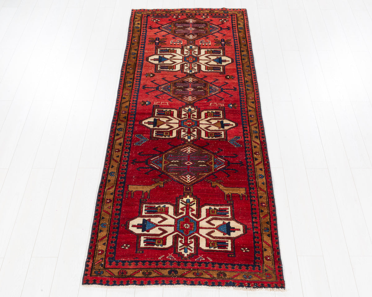 Antique Heriz Gharajeh tribal geometric medallion wool runner rug in red, camel brown, SKU 5219
